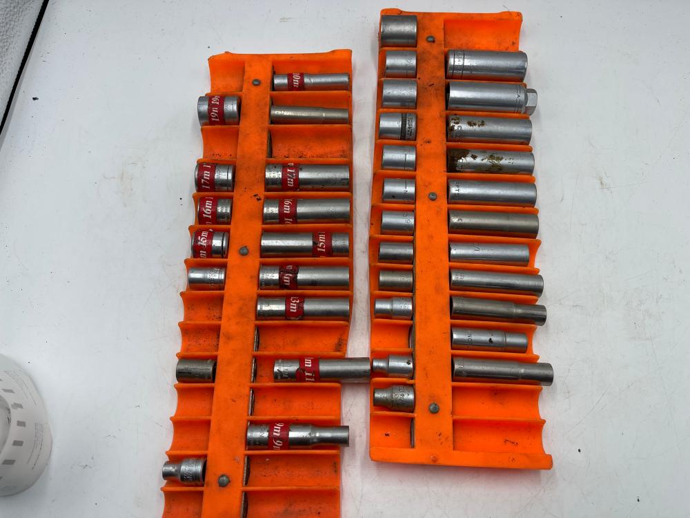 Two magnetic socket trays full of metric 3/8 drive sockets