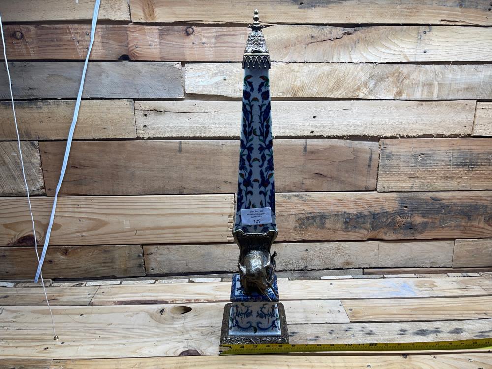 Pair of "After Bernini" Cast Metal Elephant and Porcelain Obelisk