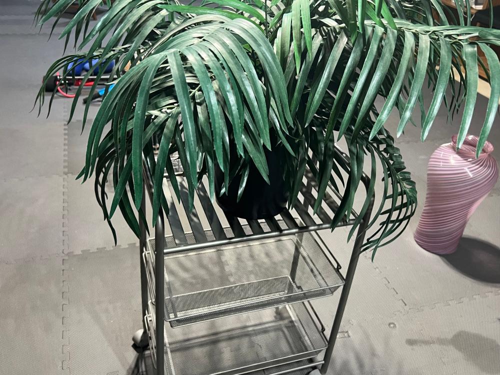 rolling shelf with faux plant