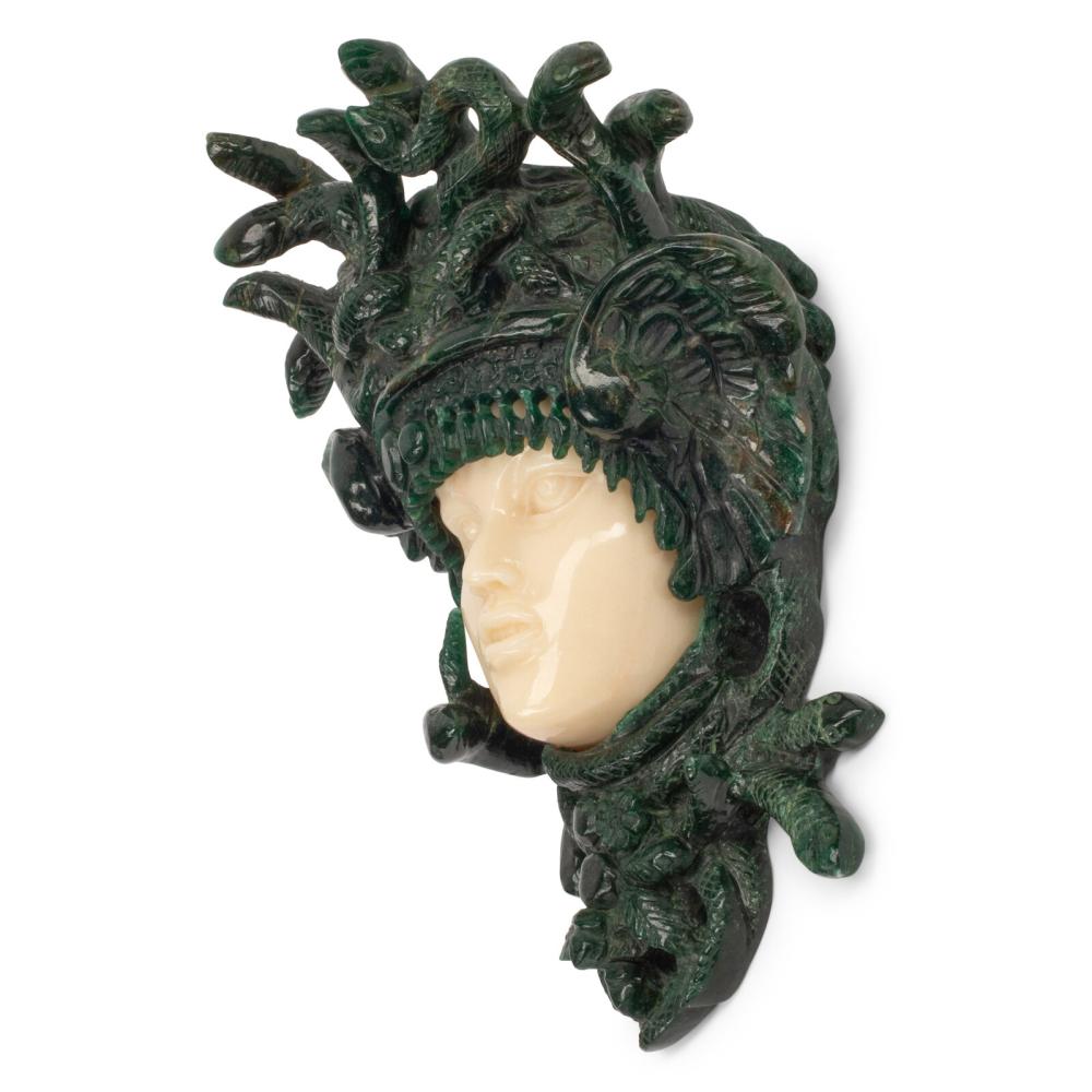 A Carved Green and Yellow Aventurine Medusa Wall Ornament