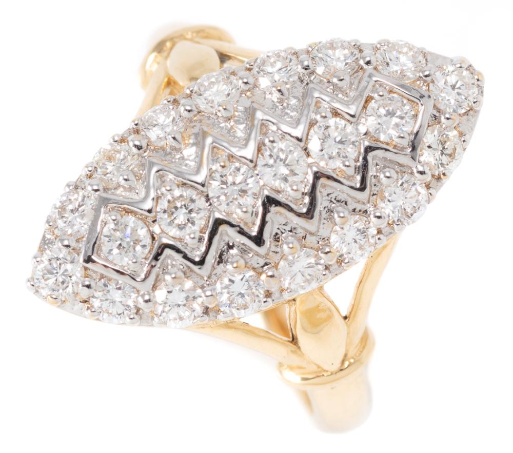 AN EDWARDIAN STYLE 18CT GOLD DIAMOND RING; marquise shape top set in line with 6 round brilliant cut diamonds to a surround of 16 ro...