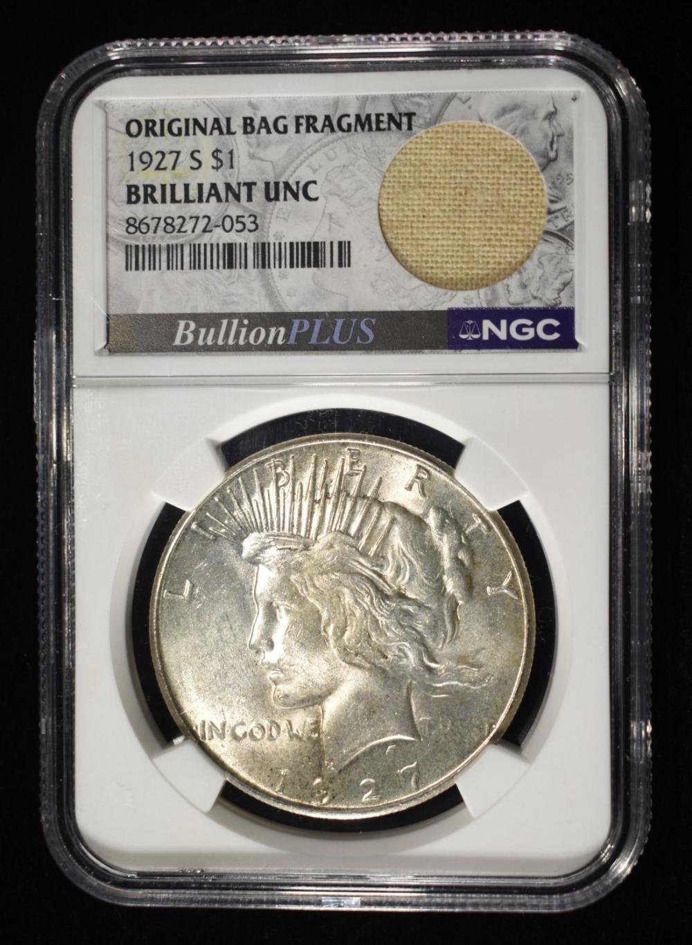 1927-S PEACE DOLLAR NGC BU WITH BAG FRAGMENT