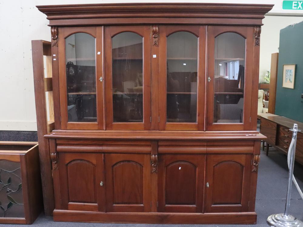 LARGE VINTAGE BOOKCASE WITH FOUR LOWER ENCLOSED CABINETS, FOUR DRAWERS AND FOUR UPPER GLASS DOORS AND CARVED FEATURES, APPROX. 207CM X 207CM X 47CM, NOTE NO KEY SUPPLIED