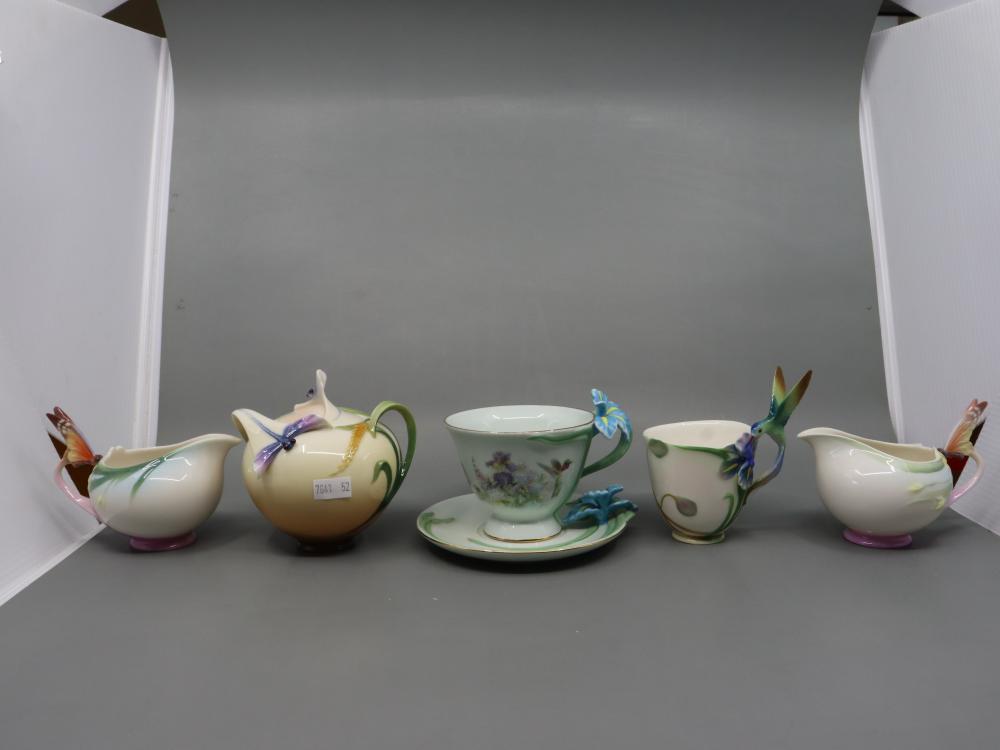 SELECTION OF FOUR PIECES OF FRANZ PORCELAIN, INC. BUTTERFLY, DRAGONFLY AND HUMMING BIRD AS WELL AS A BRADFORD ED. IRIS PATTERN TEA DUO