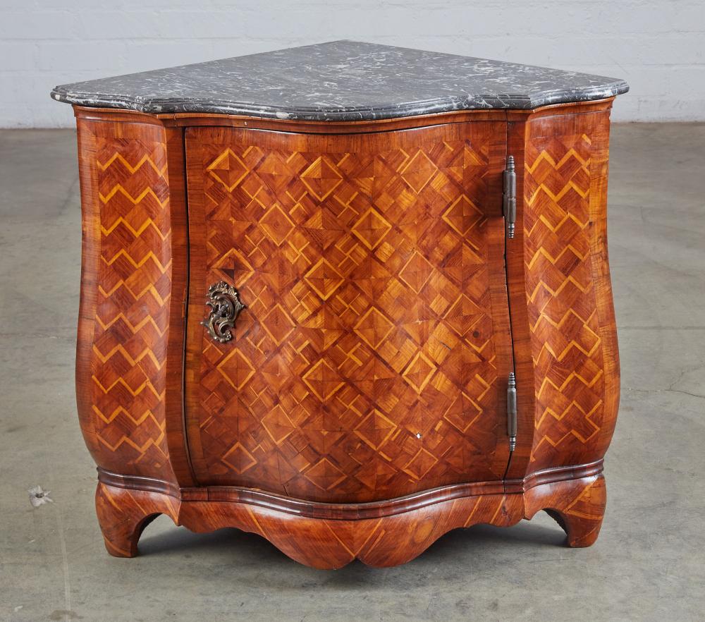 An Italian Rococo style walnut and parquetry low corner cabinet, 19th century