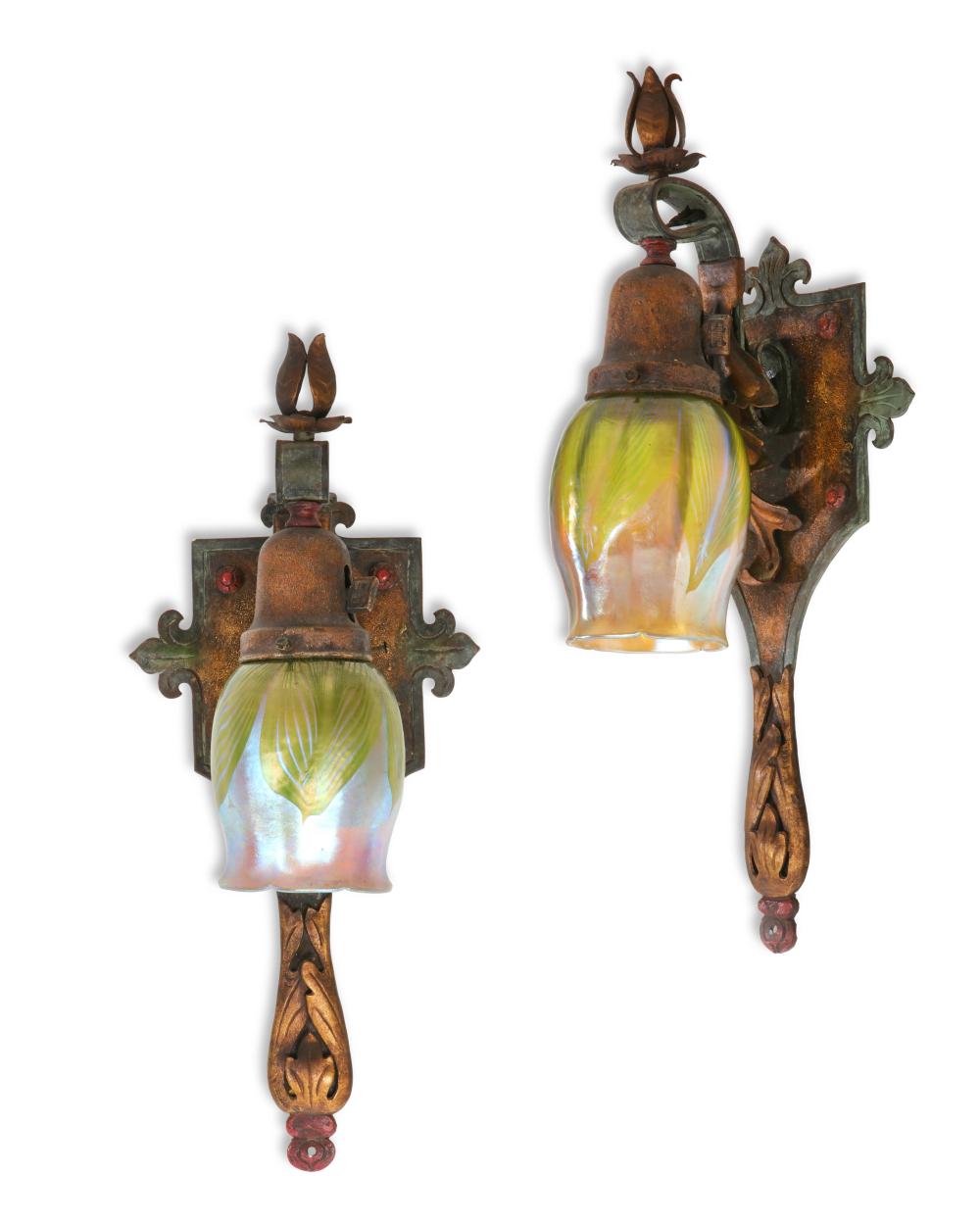 A pair of Arts & Crafts painted metal wall lights, with Tiffany Studios Favrile glass shades, early 20th century
