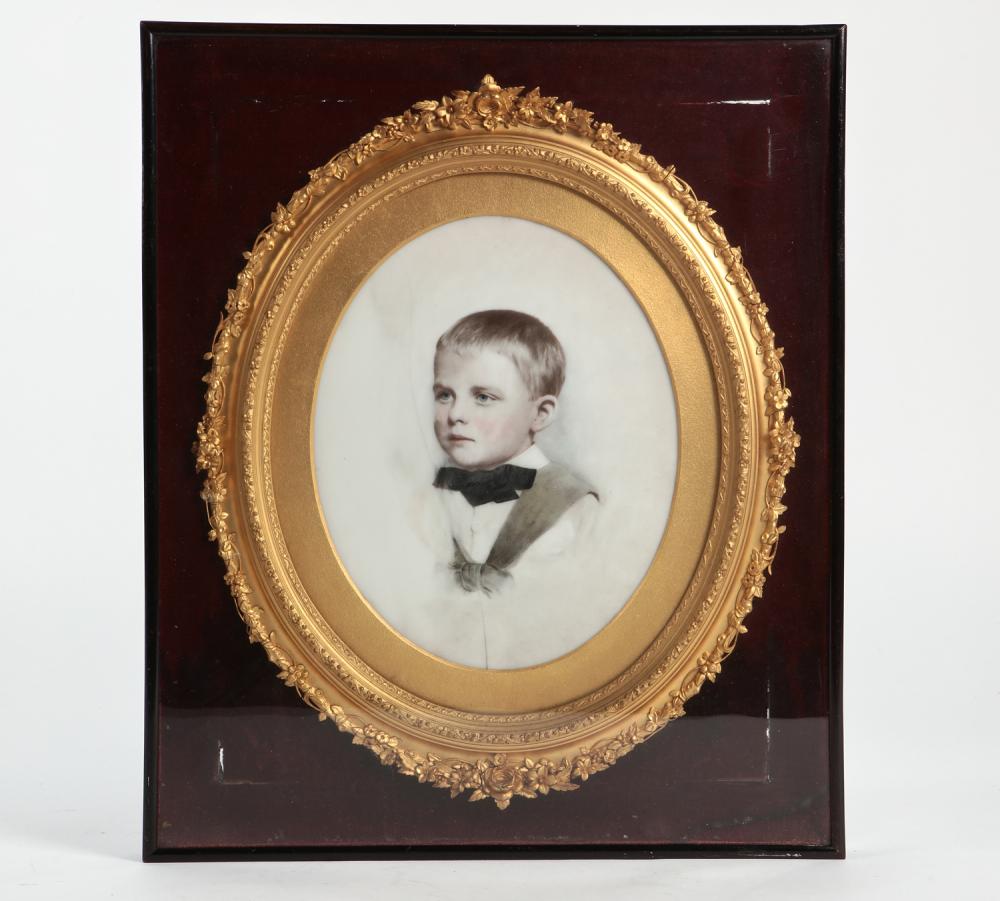 A Continental painted porcelain plaque of a young bow in a giltwood frame, late 19th/early 20th century