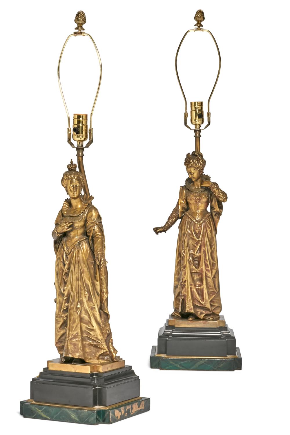A pair of French gilt bronze and black slate figures now as lamps, late 19th century