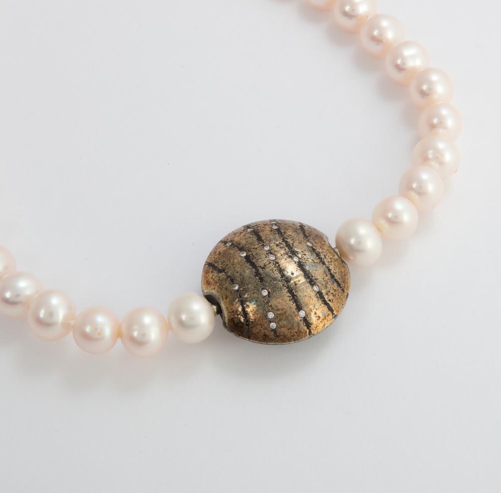 Geller: a diamond, stainless steel, platinum, 24K gold, freshwater pearl and rubber convertible necklace, length 15in (38cm); rubber cord length 18in (45.75cm)