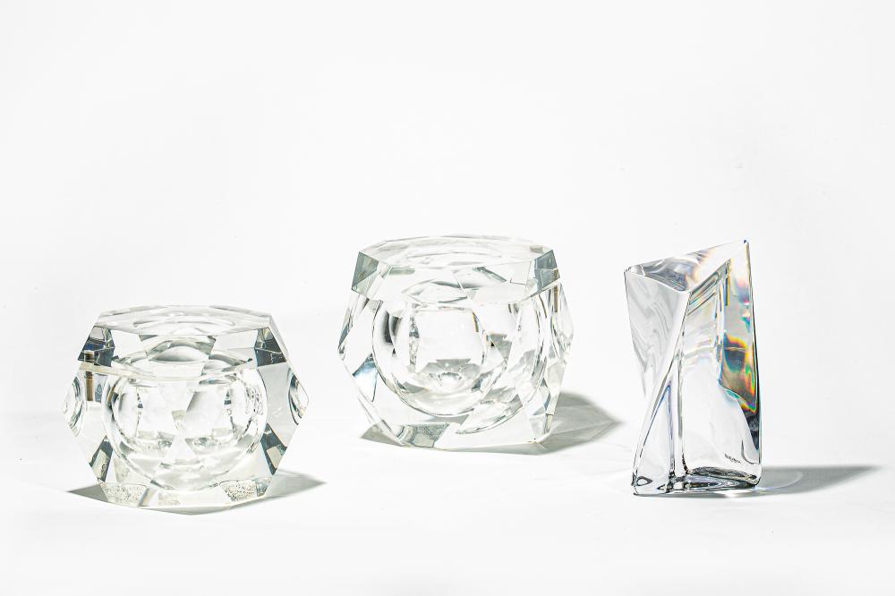 Kosta Boda: a glass sculpture, together with two octagonal lucite boxes the sculpture height 8 1/4in (21cm)