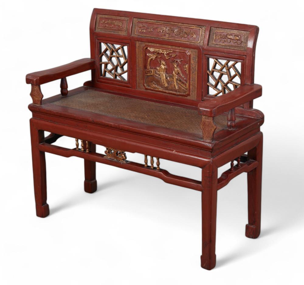A Chinese red painted and parcel gilt settee