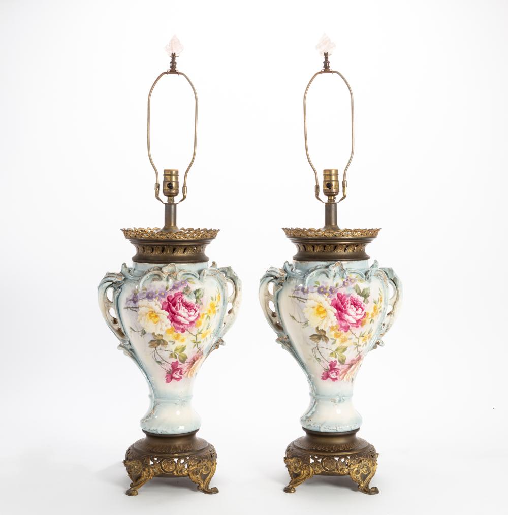 A pair of Continental gilt bronze mounted porcelain lamps second quarter 20th century