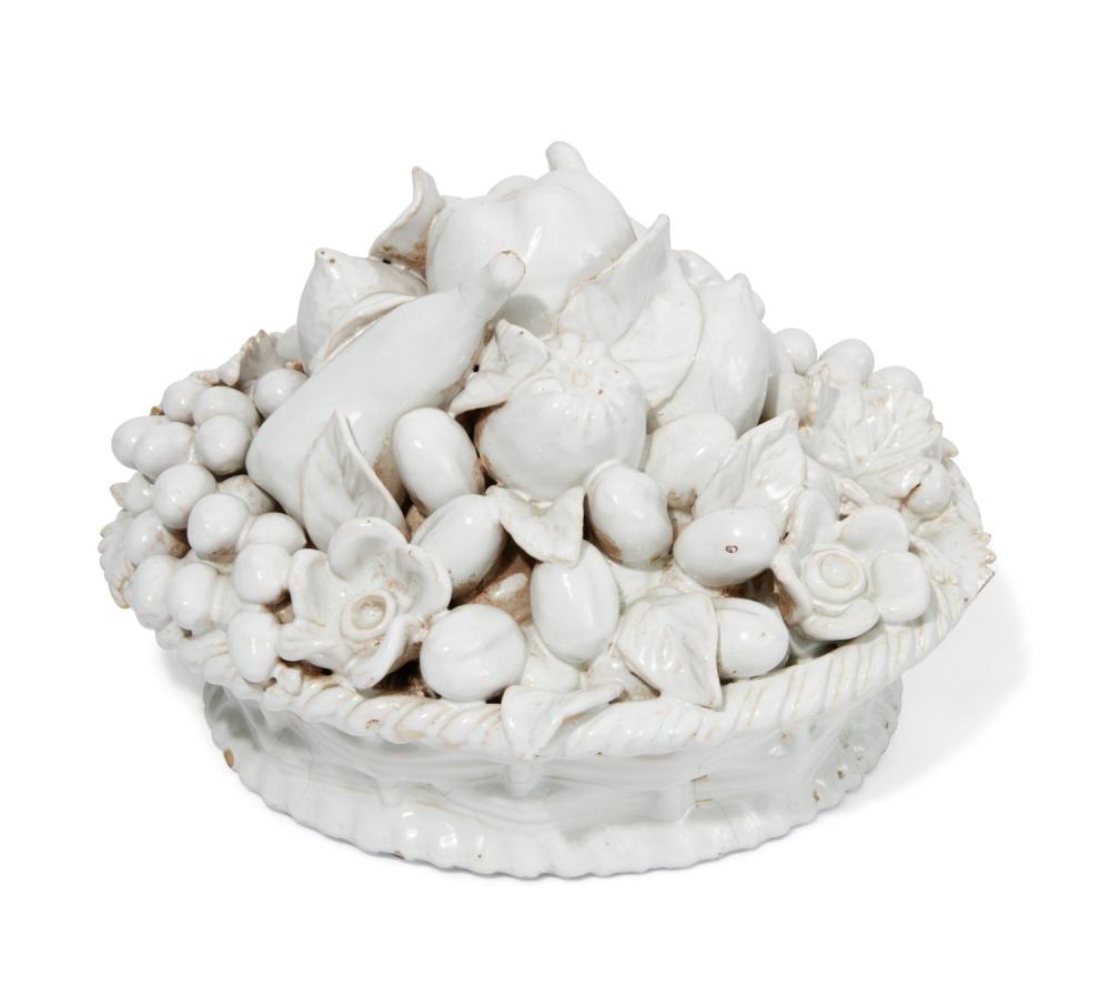 A French faience white glazed basket of fruit, 20th century