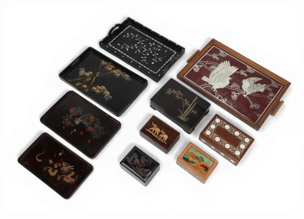 A group of ten Asian wooden trays and boxes
