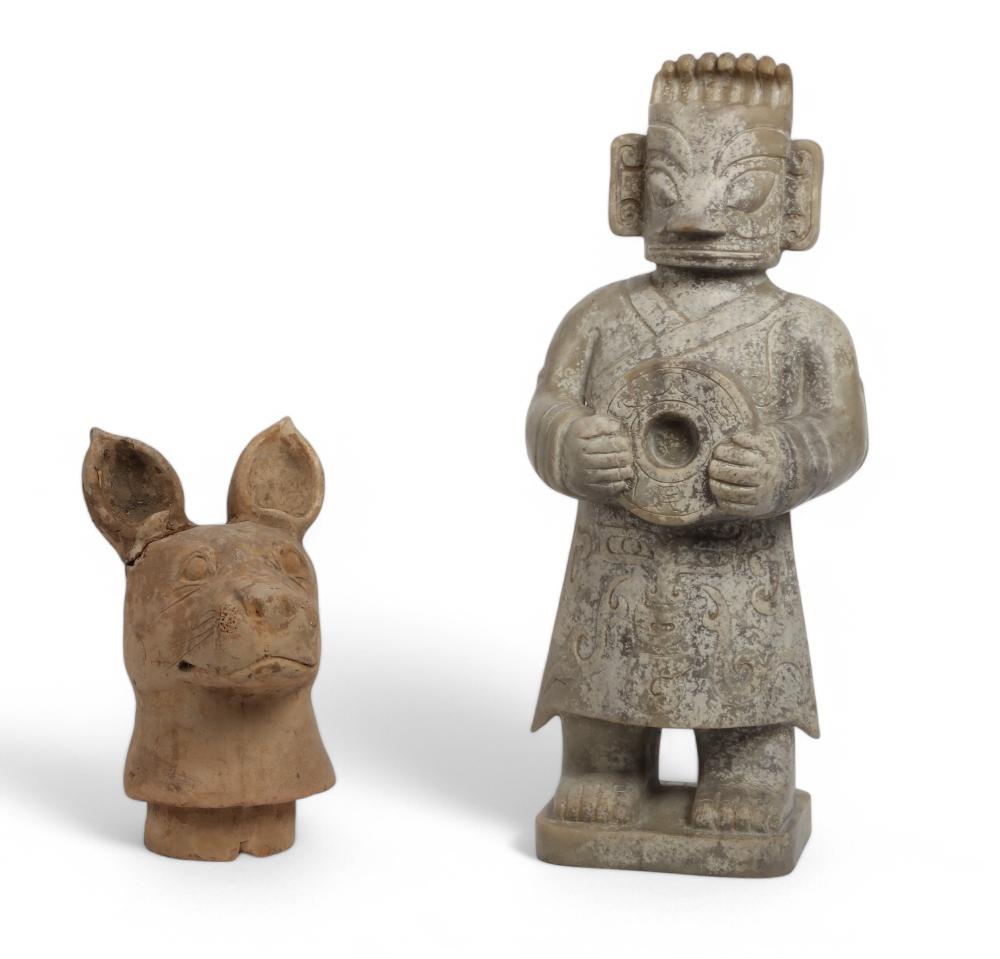 An Asian carved stone figure