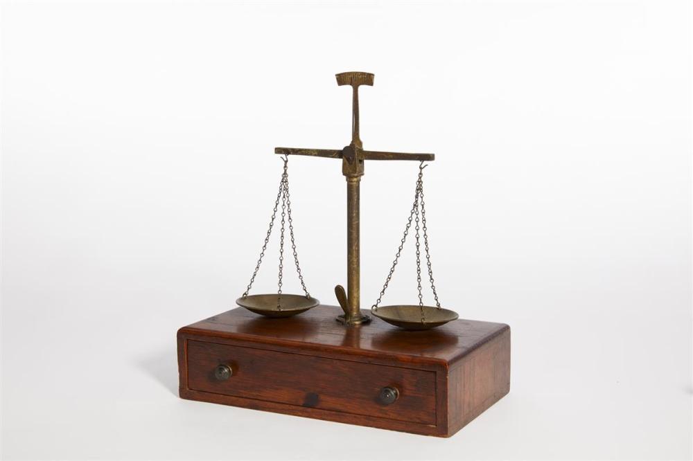 A set of brass and stained oak travel scales