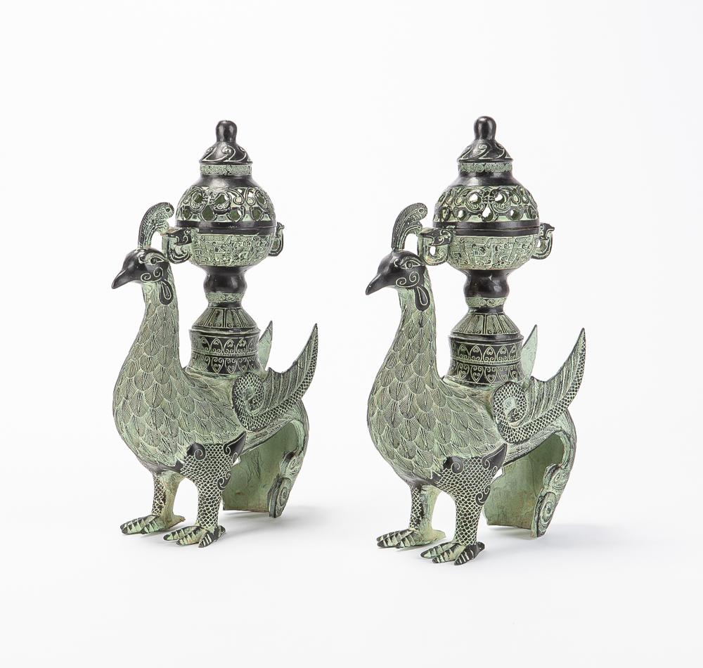 A pair of Chinese verdigris patinated metal phoenix form censers