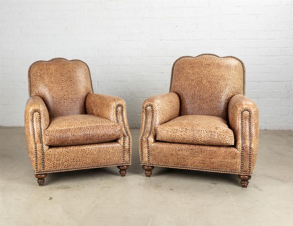 A pair of fully upholstered studded faux ostrich leather club armchairs modern