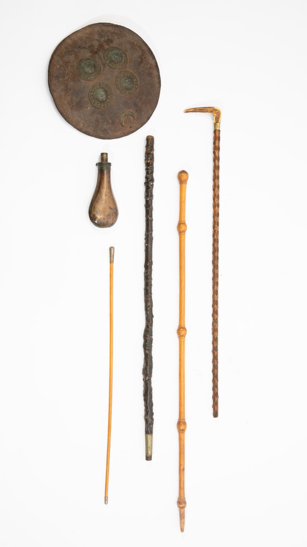 An assembled group of gentlemen's walking sticks and Militaria 19th-20th century