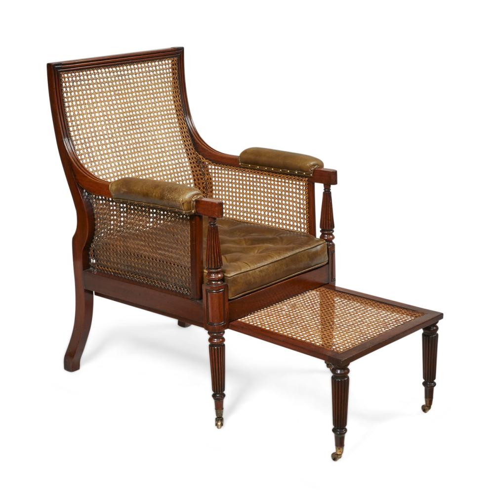 A Regency cane paneled mahogany library bergère and stool, circa 1810