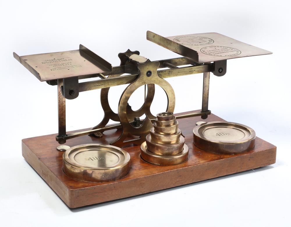 A brass postal scale