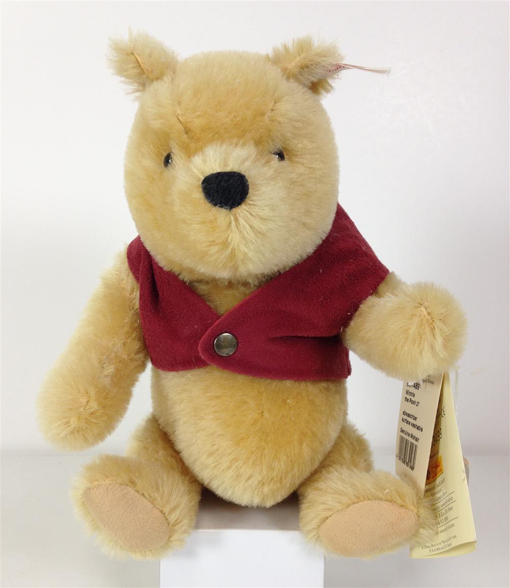 11" STEIFF CLASSIC "WINNIE THE POOH". GOLD MOHAIR, JOINTED AT NECK, SHOULDERS AND HIPS, LIMITED EDITION #3499/10,000. COMES WITH ORI...