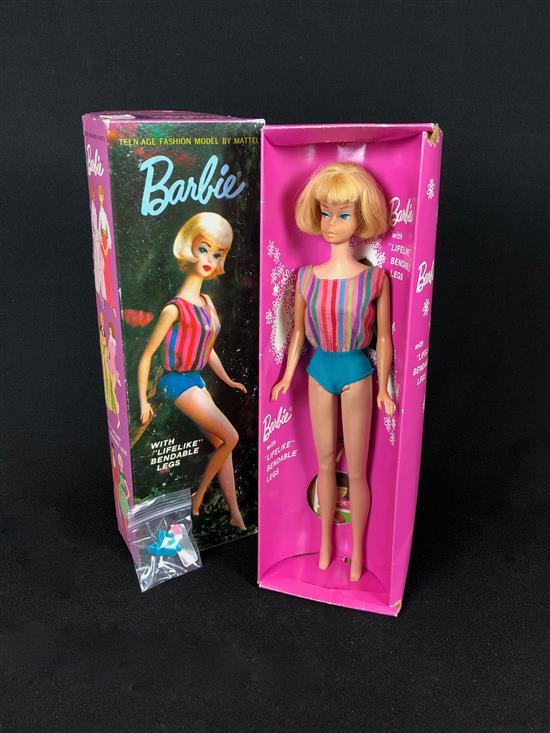 BLONDE CENTER-PART AMERICAN GIRL BARBIE WITH BENDABLE LEGS IN ORIGINAL BOX AND SWIMSUIT. COMES WITH ORIGINAL WRIST TAG, GOLD WIRE ST...