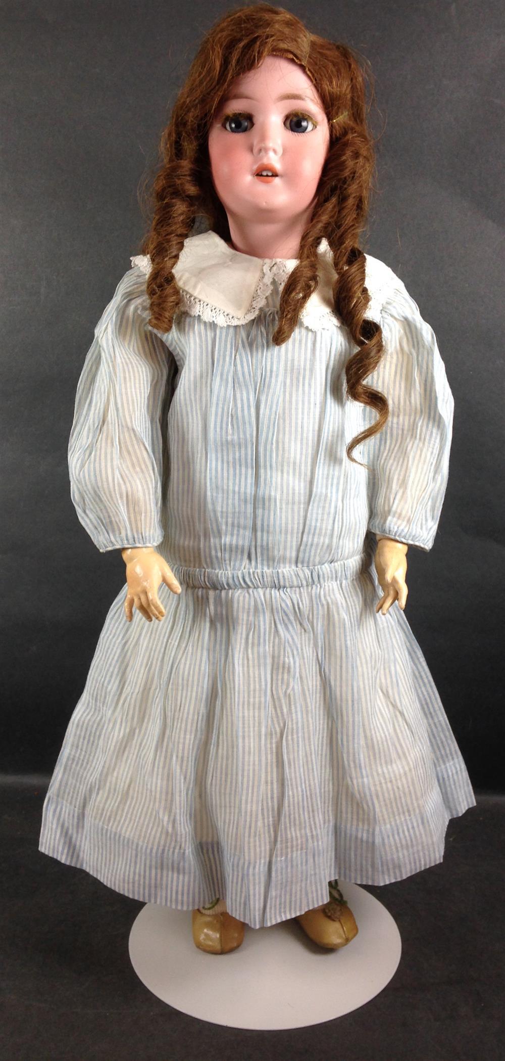 24" BISQUE SOCKET HEAD "PANSY". HUMAN HAIR WIG, GLASS SLEEP EYES, OPEN MOUTH WITH TEETH, ON JOINTED COMPOSITION BODY. DOLL WEARS ANT...