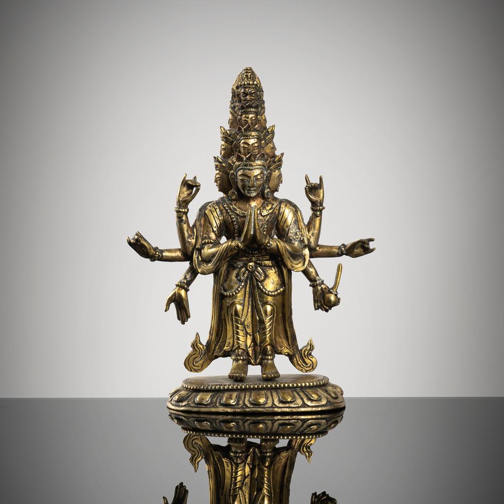 A small fire-gilded bronze of Ekadashalokeshvara
