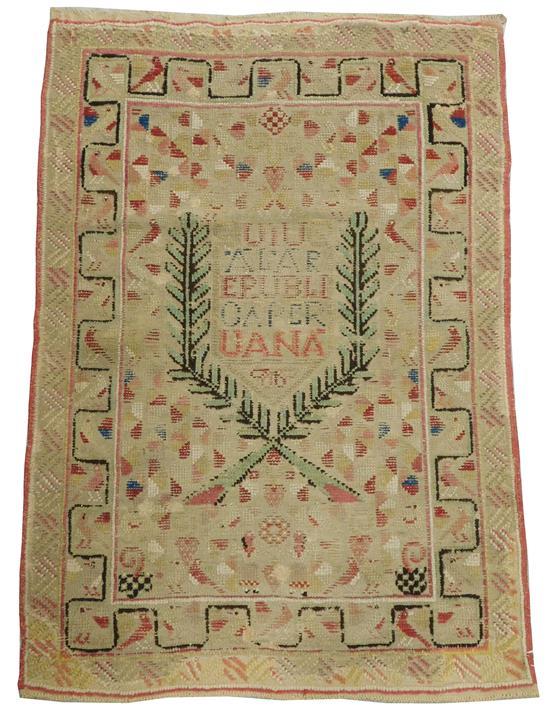 RUG: Central or South American mat with inscription, numerous rewoven areas, 2' 7" x 3' 9"