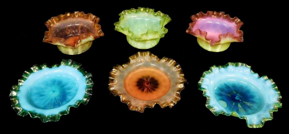 Six art glass ruffled rim bowls with threading, 20th C., various colors, three shallow and three deeper bowls, wear consistent with...