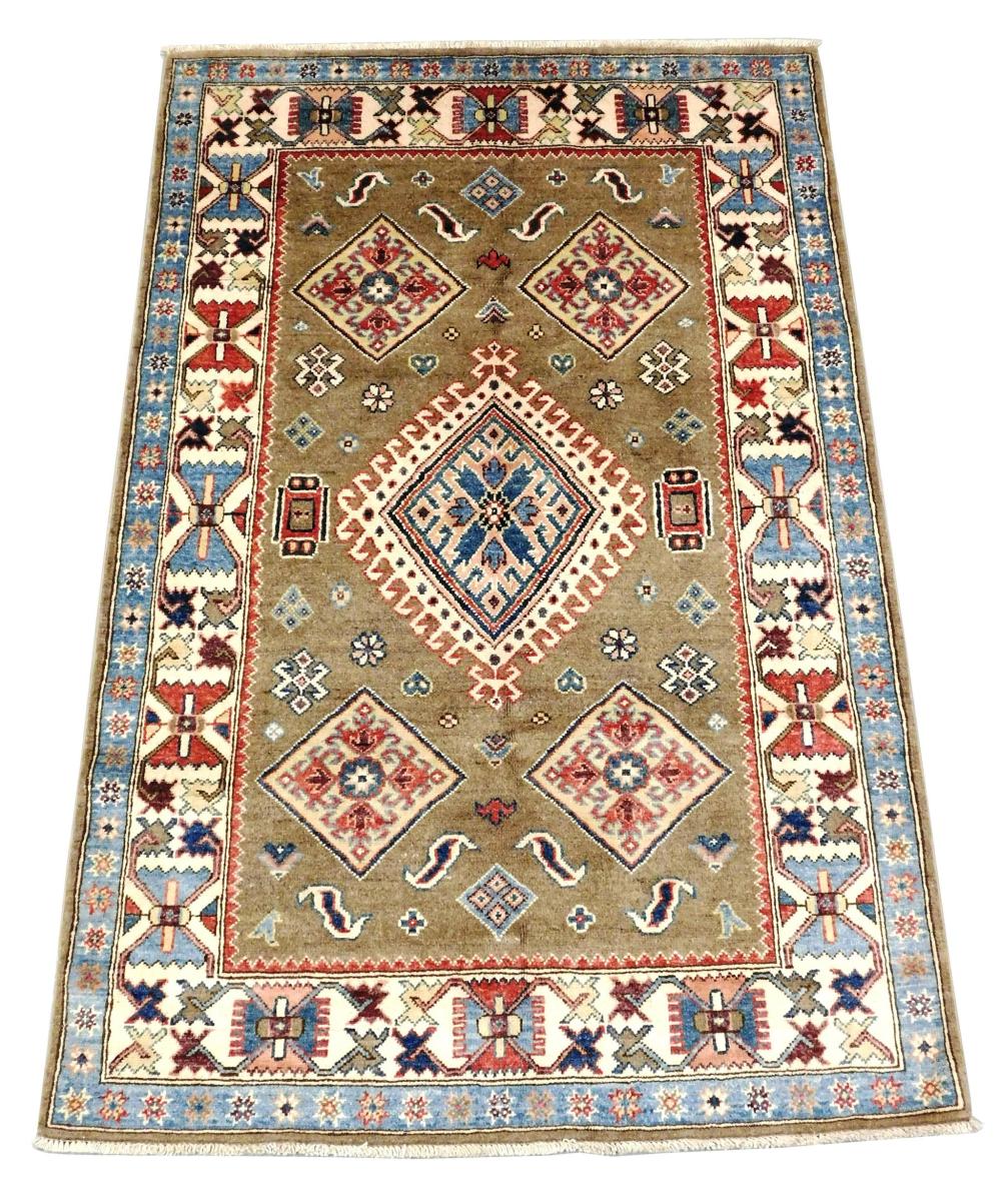 RUG: Uzbek Kazak, 4' x 6'1", handmade, 100% wool, camel field ensconced in a cream border with light blue guard border, large centra.