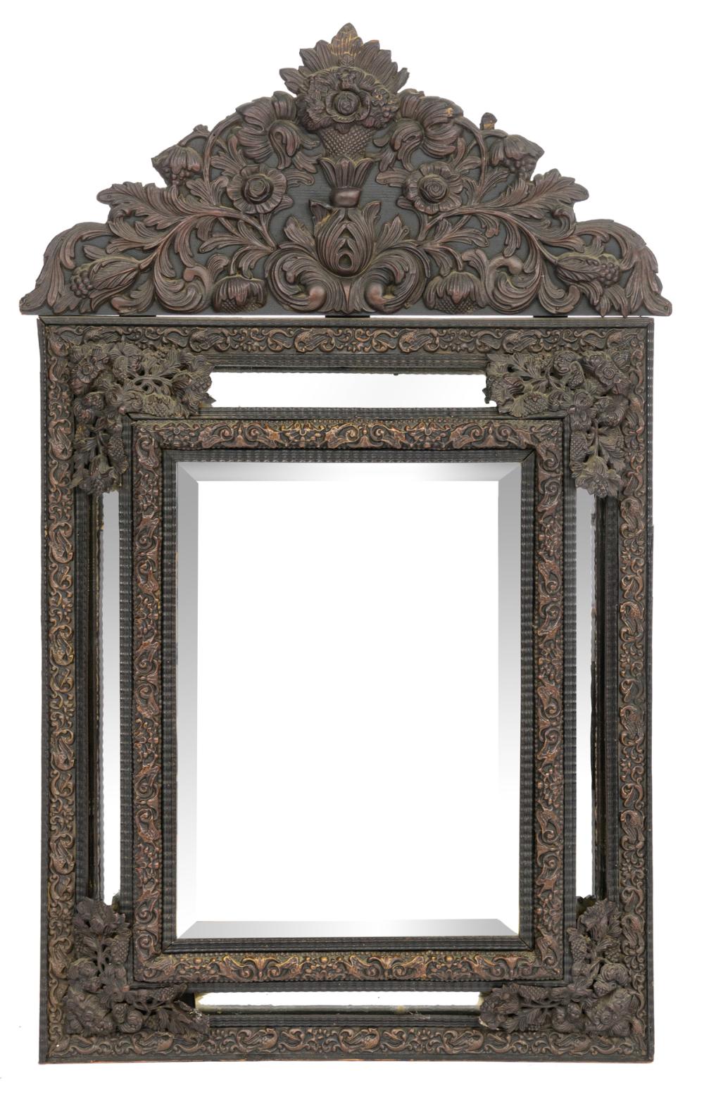 A Baroque style wall mirror with floral decorated brass fittings, H 118 – W 74 cm
