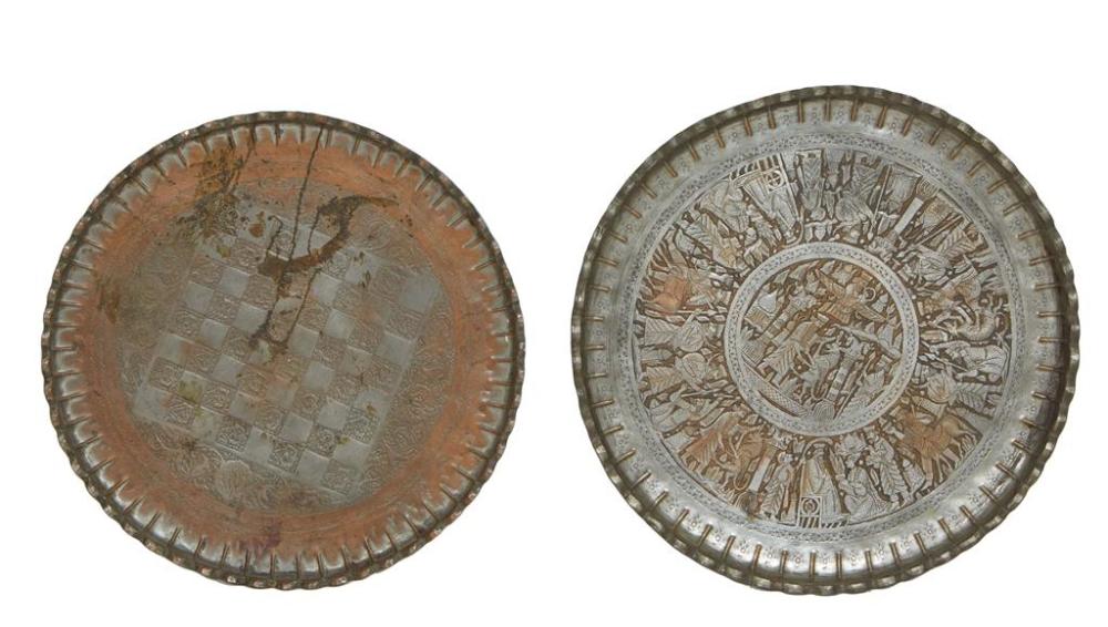Two Moroccan Circular Copper Trays, 20th c., with scalloped edges, one a chess board decorative top, the second with medieval animal...