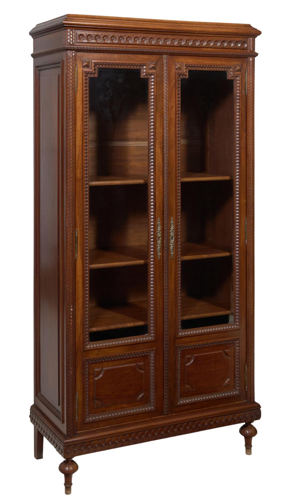 French Louis XVI Style Carved Walnut Bookcase, 20th c., H.- 68 1/4 in., W.- 33 in., D.- 14 1/2 in.