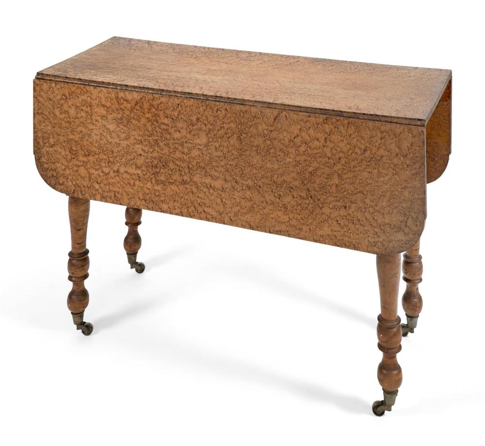 LATE SHERATON DROP-LEAF TABLE In bold bird's-eye maple. Turned legs. Height 29". Length 17.25" plus two 12.5" drop leaves. Width 42".