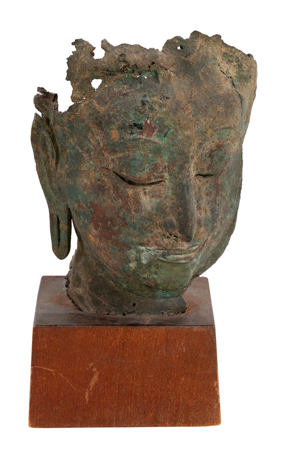 THAI ARCHAIC FRAGMENT OF A BRONZE HEAD OF BUDDHA Height 11". Base 4.25" x 4.25".