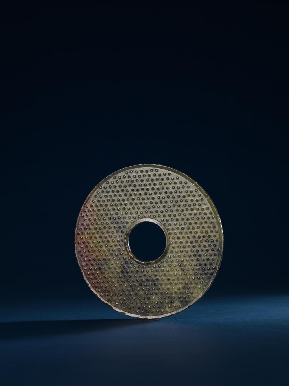 A CELADON JADE DISCS,WARRING STATES TO HAN 戰國.青玉穀紋璧