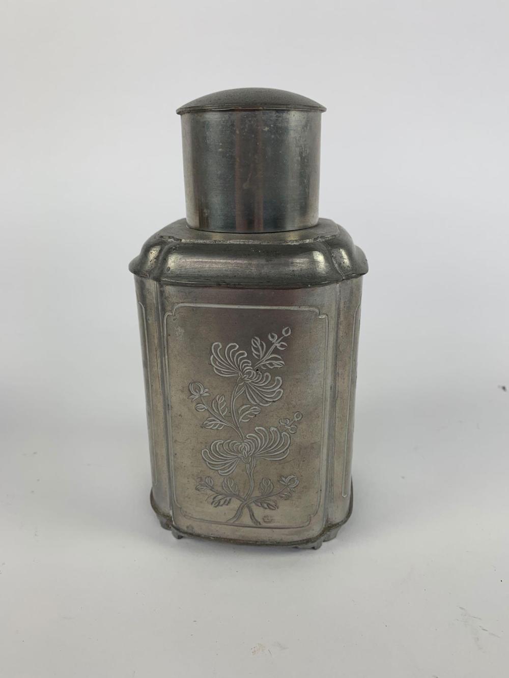 A Chinese pewter tea canister with calligraphy panels