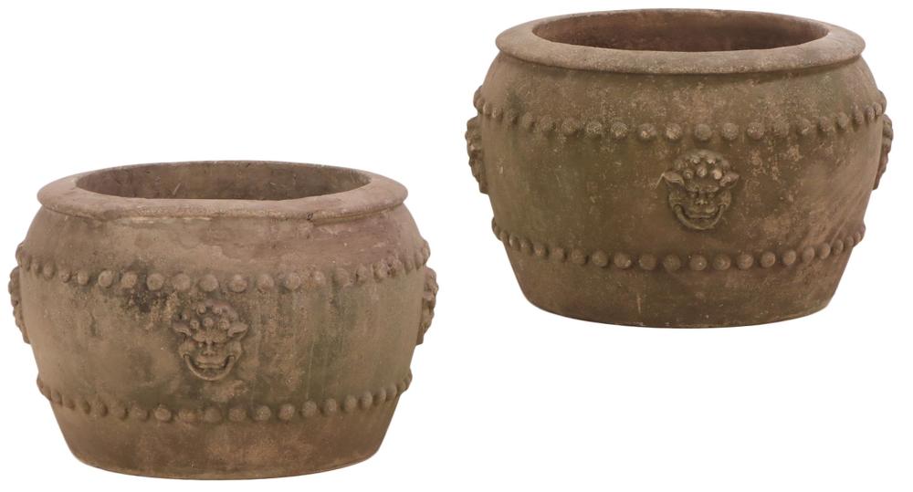 PAIR OF ROUND CAST STONE PLANTERS C 1960 WITH MEDIEVAL STYLE GARGOYLE MASKS.