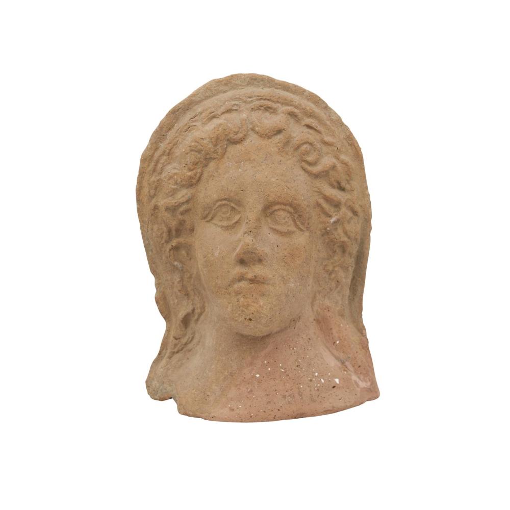 AN ETRUSCAN TERRACOTTA VOTIVE HEAD OF A FEMALE In the 3rd century BC style, possibly of the period