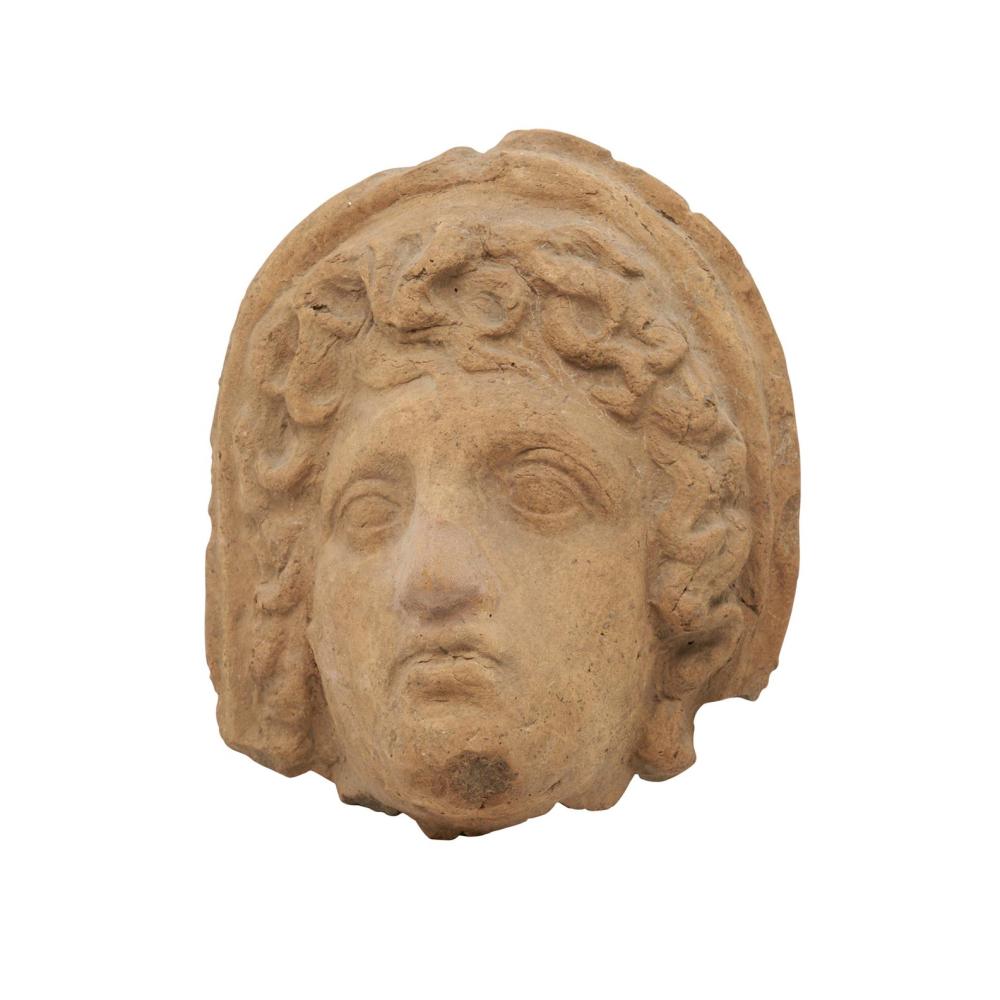 AN ETRUSCAN TERRACOTTA VOTIVE HEAD OF A MALE In the 3rd century BC style, possibly of the period