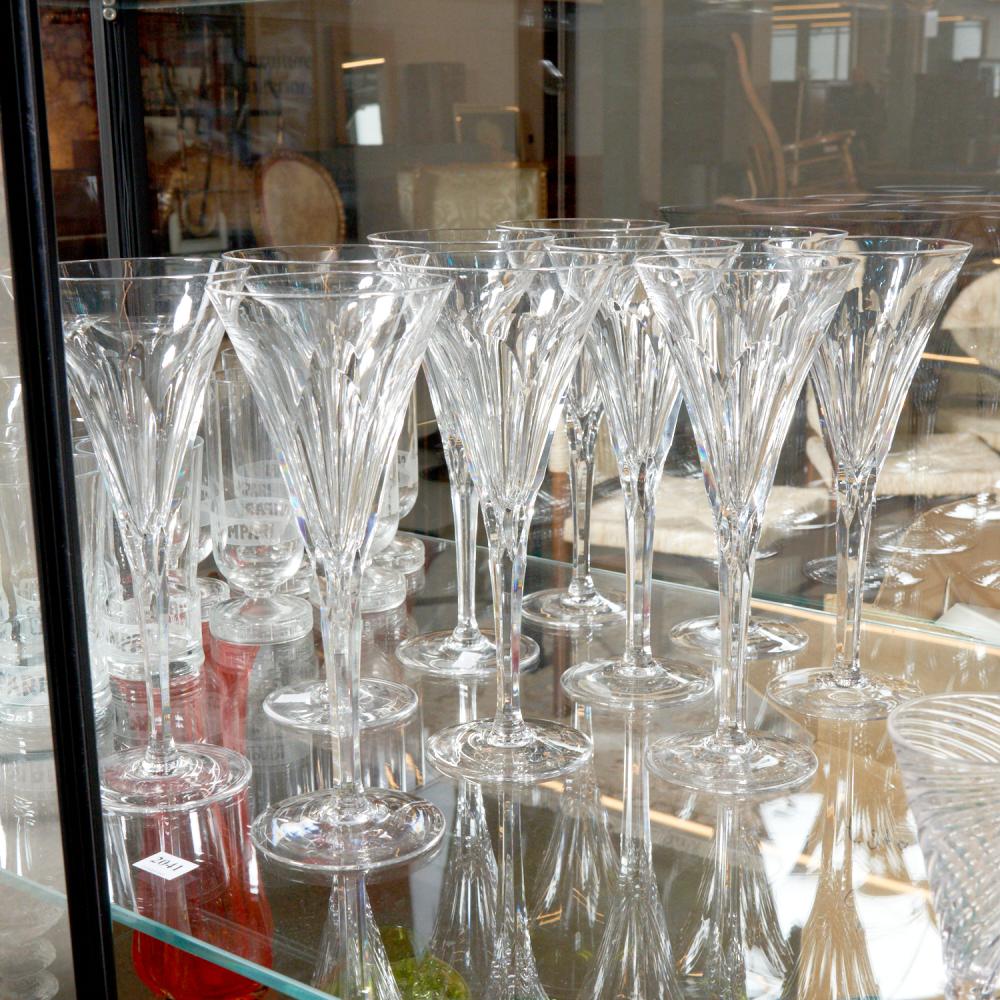 A SET OF TEN TALL PADEL CUT CRYSTAL FLUTES H.25CM