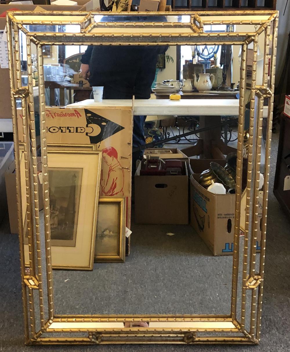 Gilt wood mirror, made in Italy, with mirrored panels comprising the frame