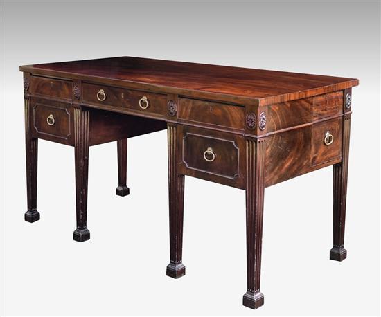 A substantial George III mahogany sideboard in the Adam style the central drawer above the recess flanked by two lined and divided c...