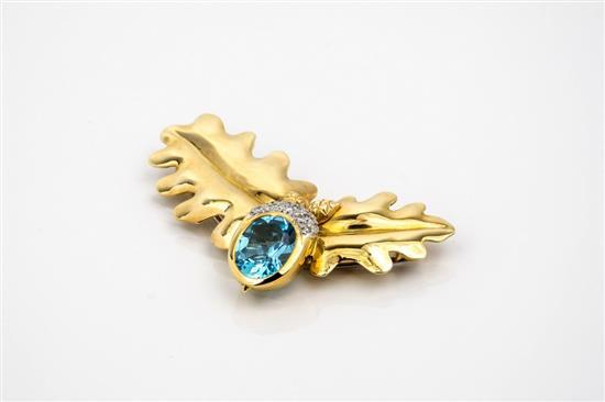 An 18ct gold, blue topaz and diamond brooch by Theo Fennell hallmarked London 1993,