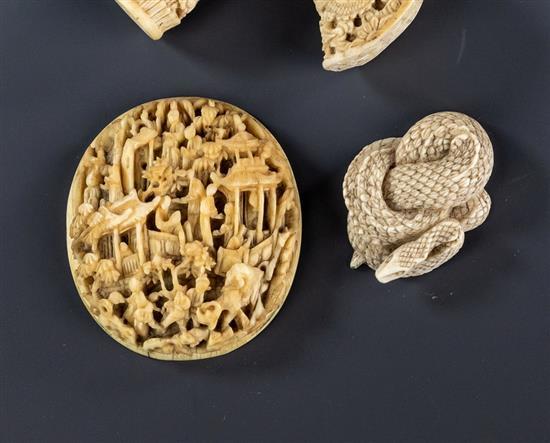 A Chinese Canton carved ivory plaque second half 19th century, decorated with figures and pagodas in a wooded landscape,