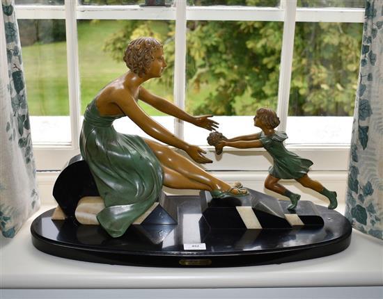 A French Art Deco bronzed spelter figural group 1920s-30s, depicting a mother and child,