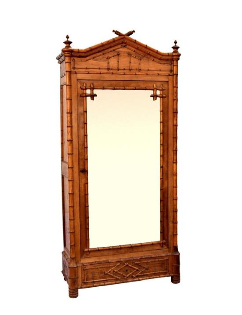 A Victorian faux-bamboo satin walnut wardrobe the peaked top with turned finials,