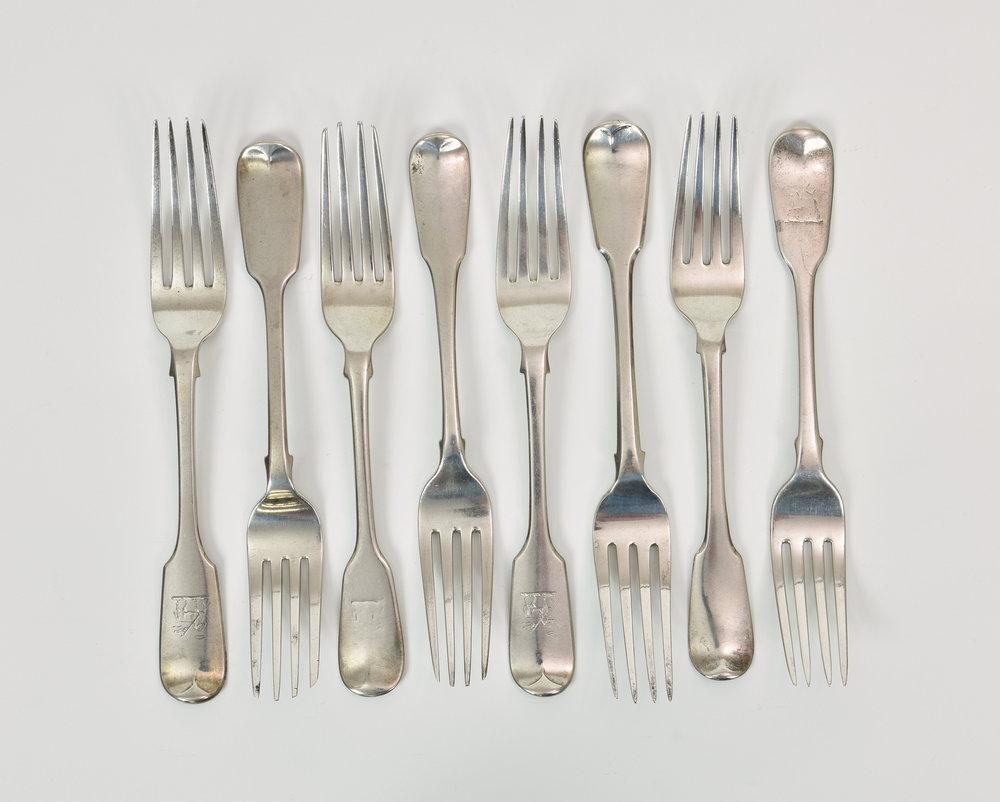A harlequin set of eight 19th century silver fiddle pattern table forks one by Solomon Hougham, 1815,